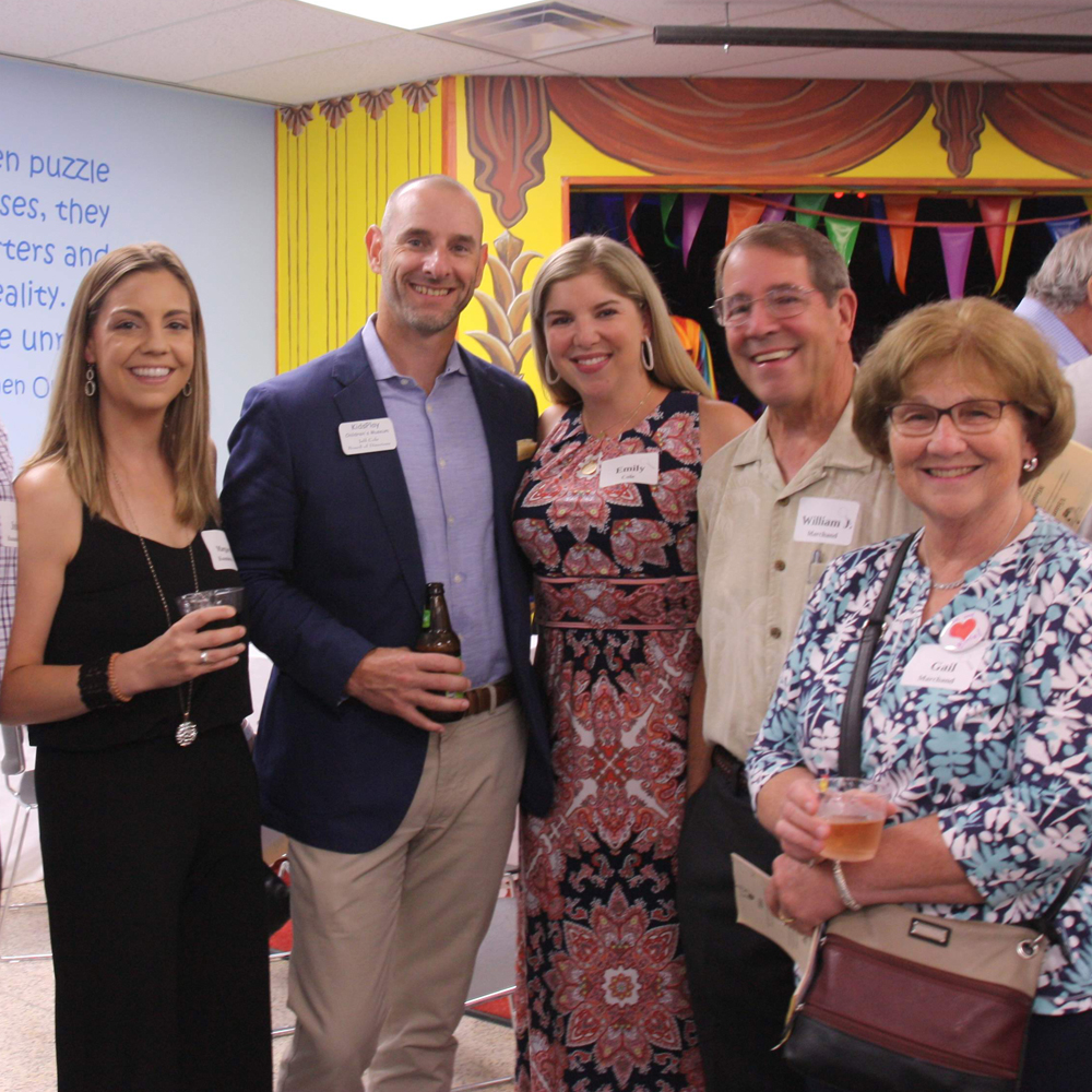Two men and three woman at an event