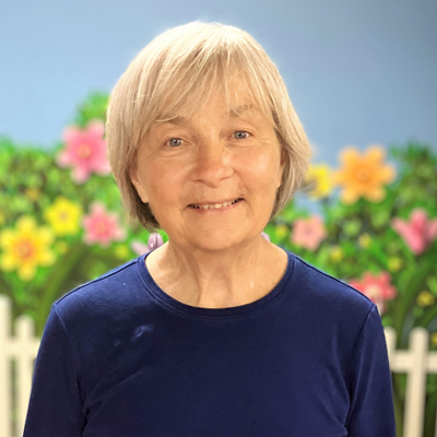 Patty Cassella Woman with blonde hair and blue shirt smiling