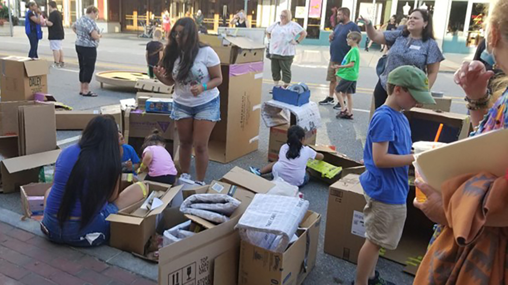 KidsPlay Birthday - Building boxed forts using materials like newspaper and boxes.